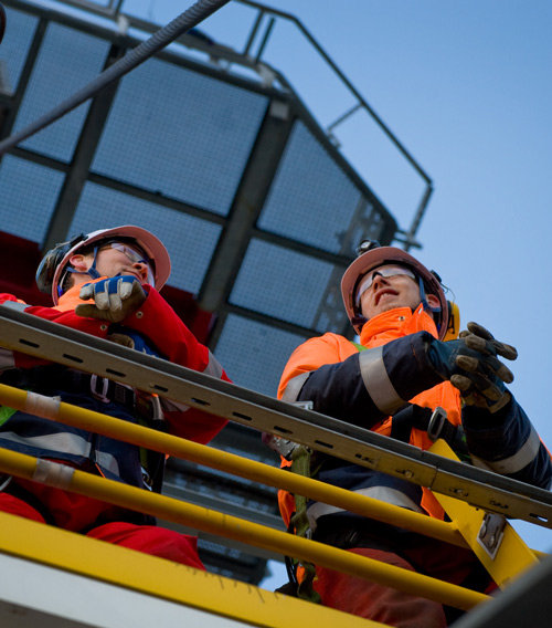 2 men looking out from above